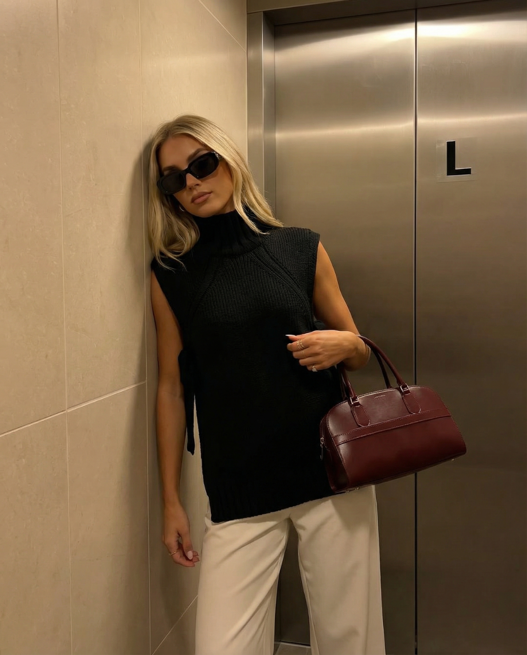 Vera | Sleeveless Ribbed Sweater Black Turtleneck Tie Side